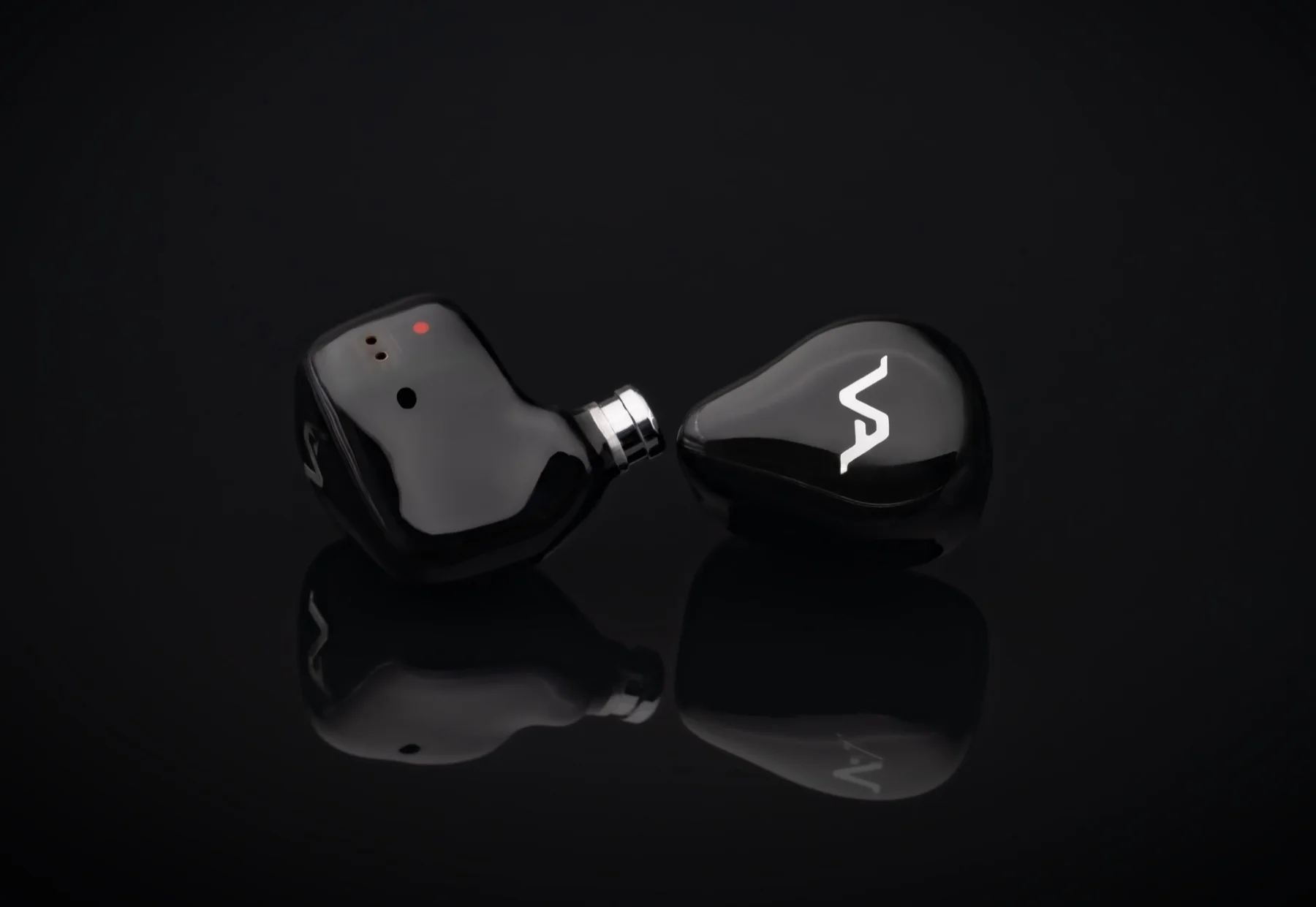 Onyx black pair, one shell turned to show the vents and bore