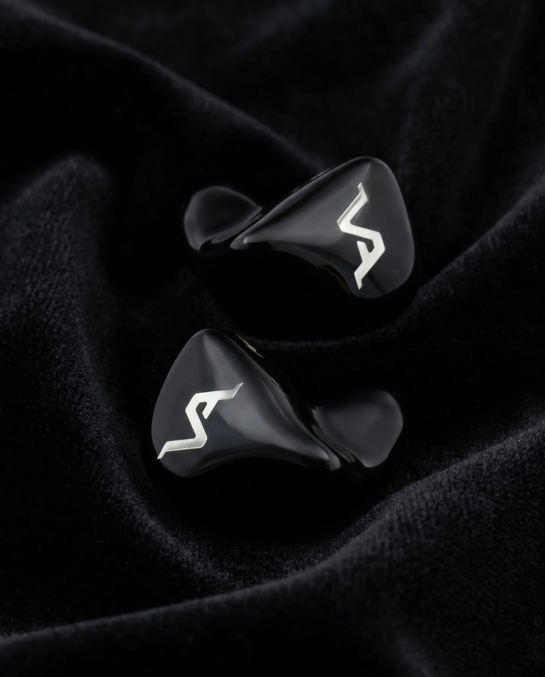 Apex Onyx — pair stacked on velvet